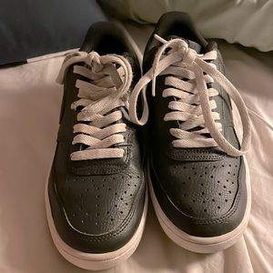 Nike black shoes. WORN for a few days. White laces